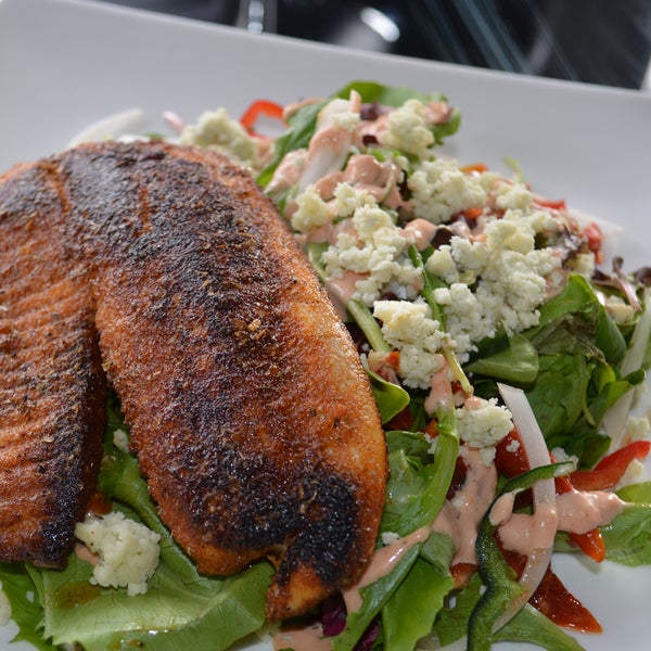 Happy Tuesday..try our Blackened Tilapia Salad with Roasted Tomato, Gorgonzola & a Roasted Pepper Aioli $11 & enjoy a FREE Glass of White Wine with it!