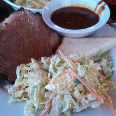 Photo taken at T-Rex Barbecue by Denise C. on 1/7/2013