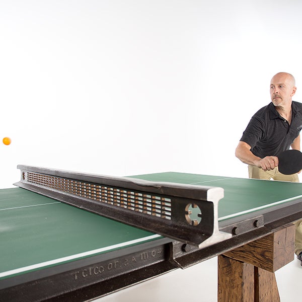 Robert Playing Table Tennis on our new table design.