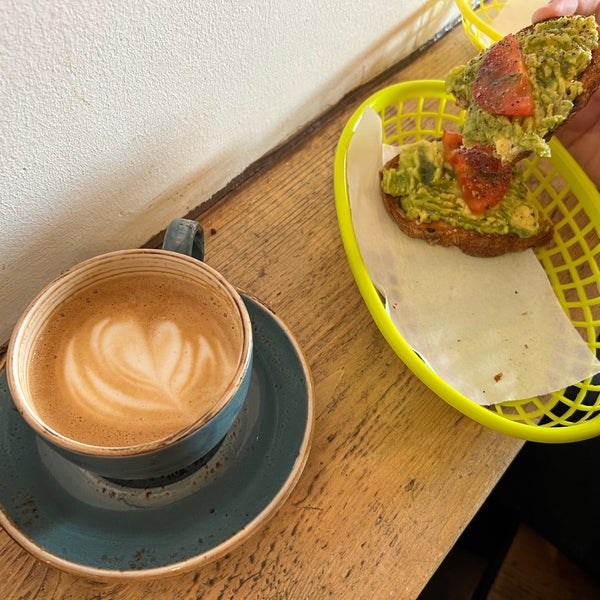 Avocado toasts and capuccino