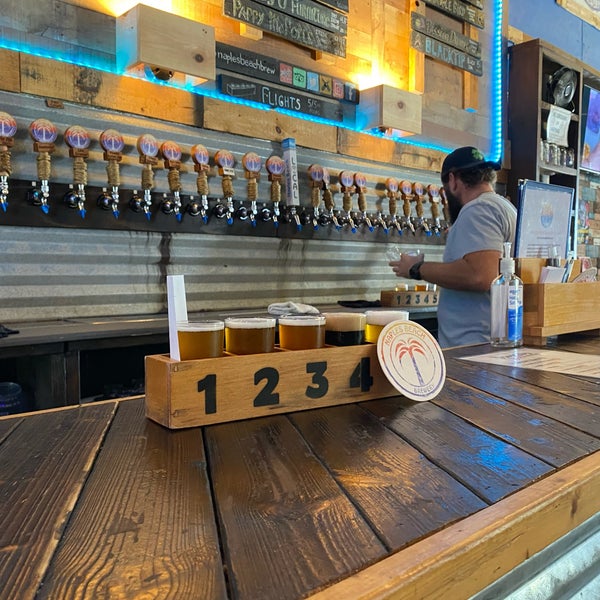 Photo taken at Naples Beach Brewery by Sofia H. on 3/30/2022