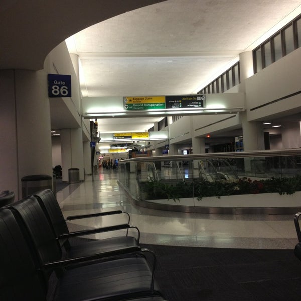 Photo taken at Gate C86 by Michael Y. on 12/30/2012