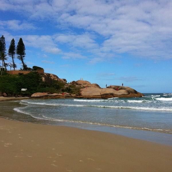 Photo taken at Praia da Joaquina by Eloah C. on 4/23/2013