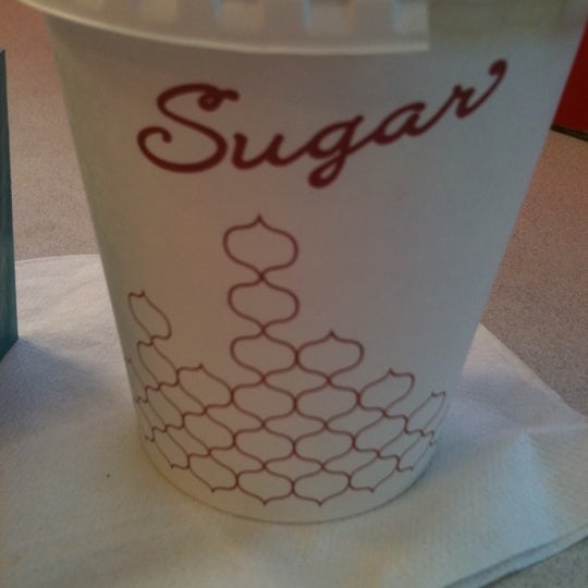 Photo taken at Sugar Cafe by Myla T. on 11/29/2012