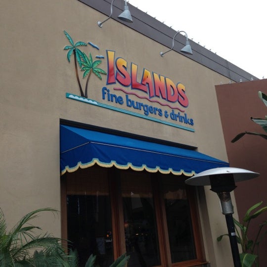 Photo taken at Islands Restaurant Long Beach Towne Center by Erik R. on 12/16/2012