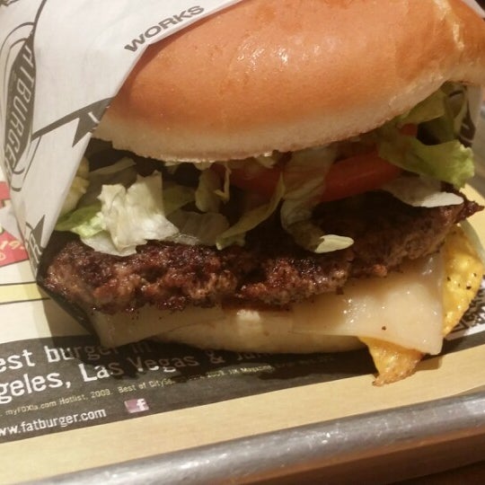 Photo taken at Fatburger by Miguel B. on 5/23/2014