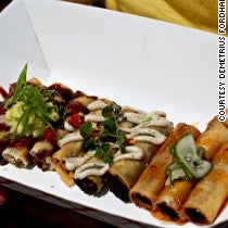 Unlike regular street food, Lumpia Shack's plating is restaurant quality: the lumpia are arranged artfully on a tray, drizzled with homemade sauce and garnished with pea shoots and pickled vegetables.