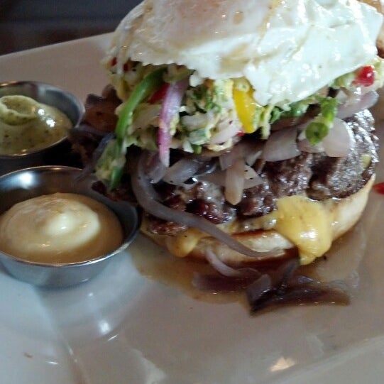 Photo taken at Grind Burger Bar &amp; Lounge by Soy on 6/11/2013