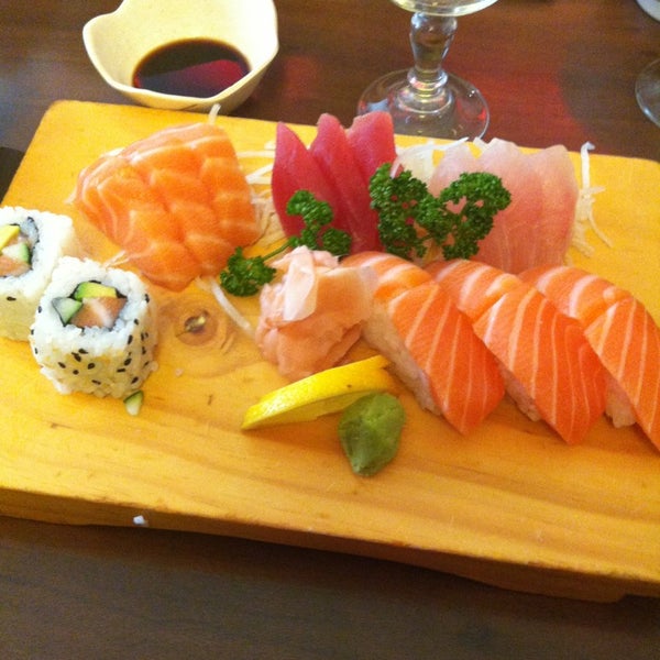Photo taken at Okinawa Sushi by céline m. on 3/26/2013