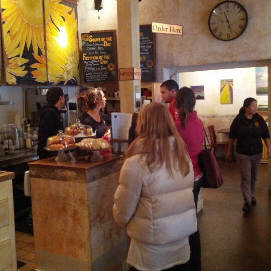 Photo taken at Sunflower Caffé Espresso &amp; Wine by Franck on 11/20/2012