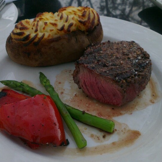 Photo taken at The Keg Steakhouse + Bar - Windsor Riverside by Nelson L. on 6/14/2013