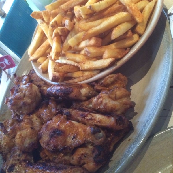 Photo taken at Nando&#39;s by Gina T. on 6/18/2014