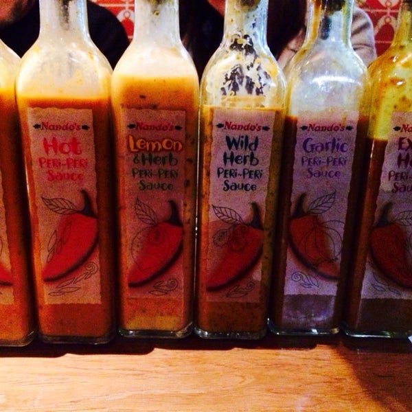 Photo taken at Nando&#39;s by Gina T. on 12/18/2013