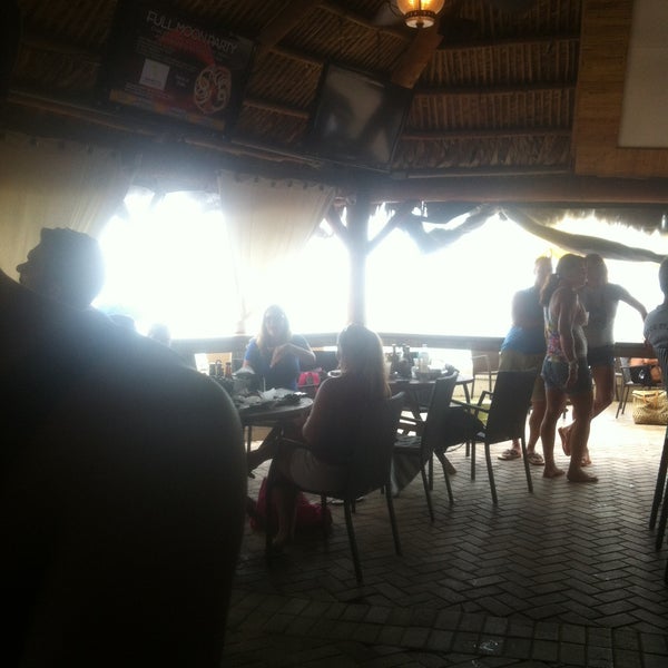 Foto diambil di Bamboo Beach Tiki Bar &amp; Cafe oleh Shawn N. pada 6/2/2013