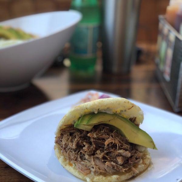 Photo taken at Pica Pica Arepa Kitchen by Cassie M. on 5/31/2019
