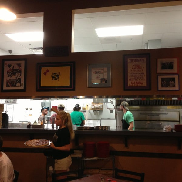 Photo taken at Theo&#39;s Neighborhood Pizza by Whitney R. on 7/28/2013