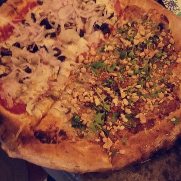 My dad and I split a pizza and a SIDE-size salad (=$20!!), and a beer each and was plenty of food. They can do halves of any pizza except their daily Special; my Thai Pie half was BOMB