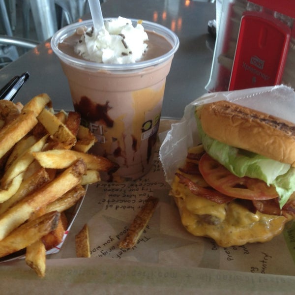 Photo taken at BurgerFi by Vinny S. on 6/27/2013