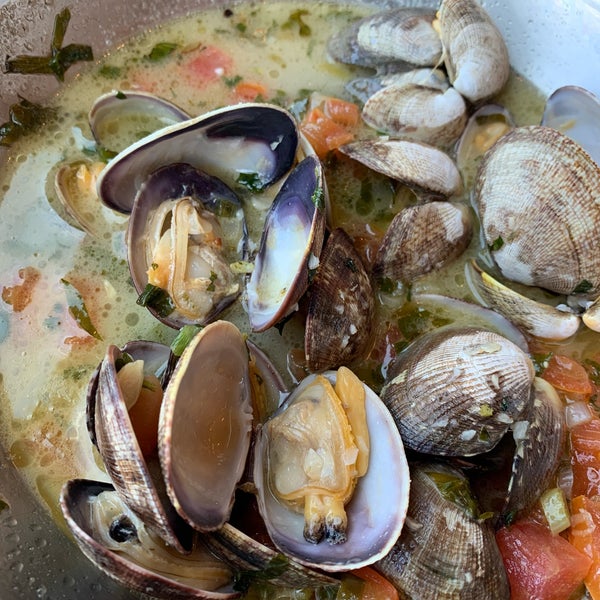Manila clams in wine, butter, garlic and parsley sauce with garlic bread. So good you’ll dip away until there is none!