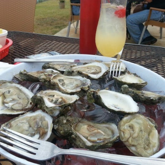 Photo taken at Moondog Seaside Eatery by Traci M. on 11/10/2012