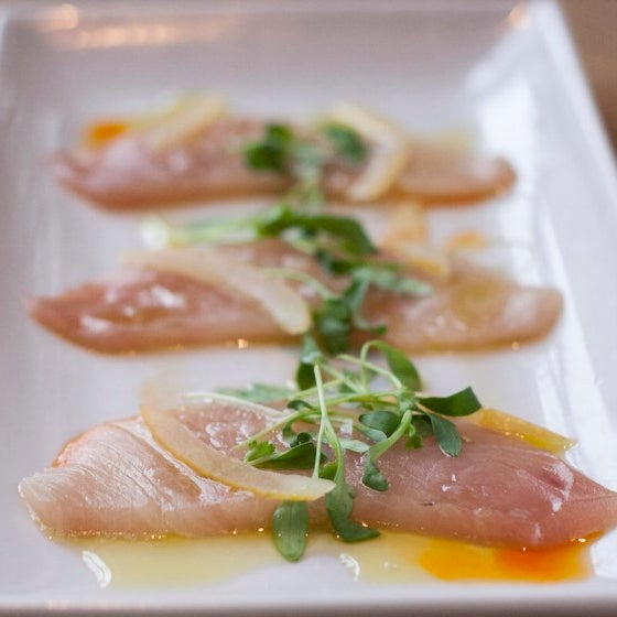 In the crudo at MK in Chicago, the daily catch of fresh seafood is drizzled with lemon Agrumato oil, and ingredients like blistered shishito peppers, seasonal apples or torpedo onion dust.