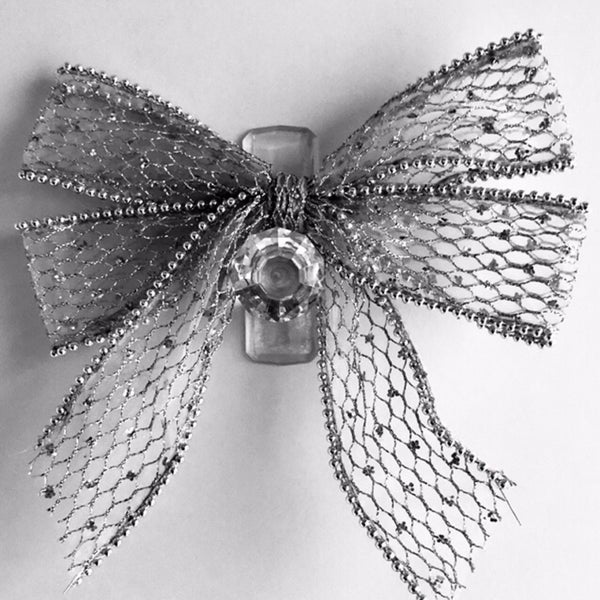 Silver bows on crystal hooks for holiday decorations! The details matter at Eden Day Spa!