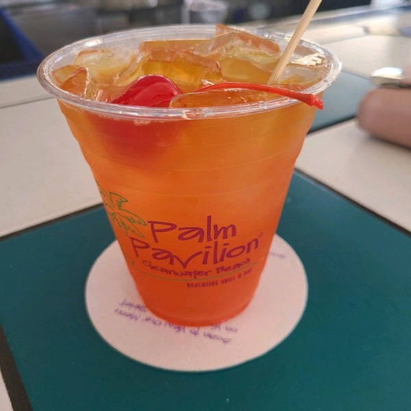 Photo taken at Palm Pavilion Beachside Grill &amp; Bar by Ryan D. on 3/17/2021