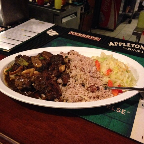 Photo taken at Jamaica Gates Caribbean Restaurant by Taylor R. on 2/6/2014