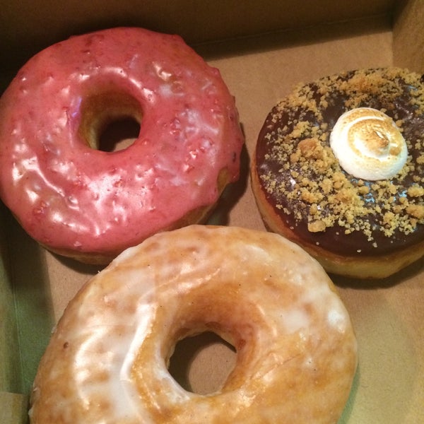Photo taken at Glazed Gourmet Doughnuts by Ashley C. on 12/19/2014