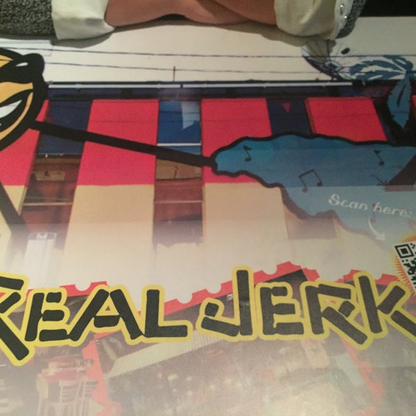 Photo taken at The Real Jerk Restaurant by Emily S. on 1/4/2016