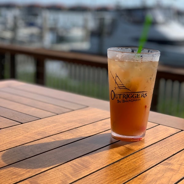 Photo taken at Outriggers Tiki Bar and Grille by Rusty P. on 11/18/2018