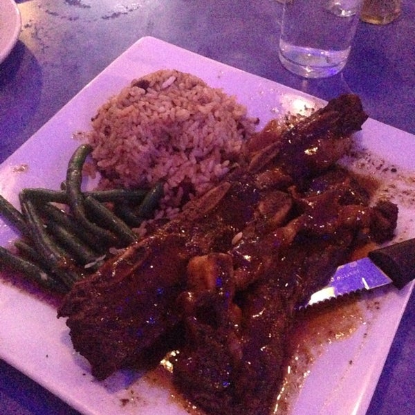 Photo taken at Reef Caribbean Restaurant And Lounge by Adriana E. on 2/23/2014