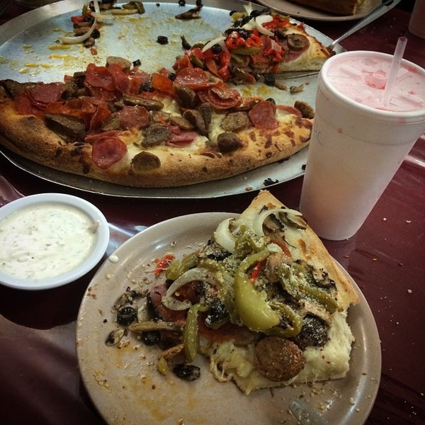 Photo taken at Authentic New York Pizza by Ray V. on 9/7/2014