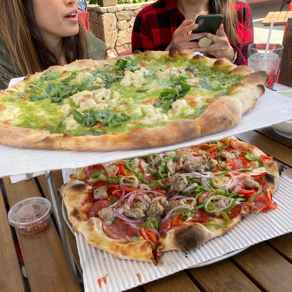 Photo taken at Howie&#39;s Artisan Pizza by Christian F. on 4/4/2021