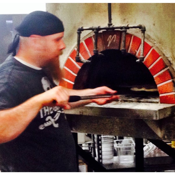 Photo taken at Fratelli&#39;s Wood-Fired Pizza by Dave R. on 5/11/2014