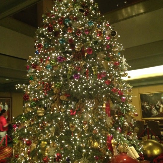 Photo taken at Windsor Court Hotel by Kelly B. on 12/18/2012