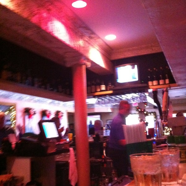 Photo taken at Tropics Piano Bar &amp; Restaurant by Brian B. on 12/21/2012