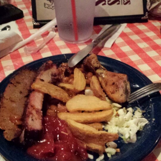 Photo taken at Famous Dave&#39;s Bar-B-Que by Stephanie G. on 7/5/2014
