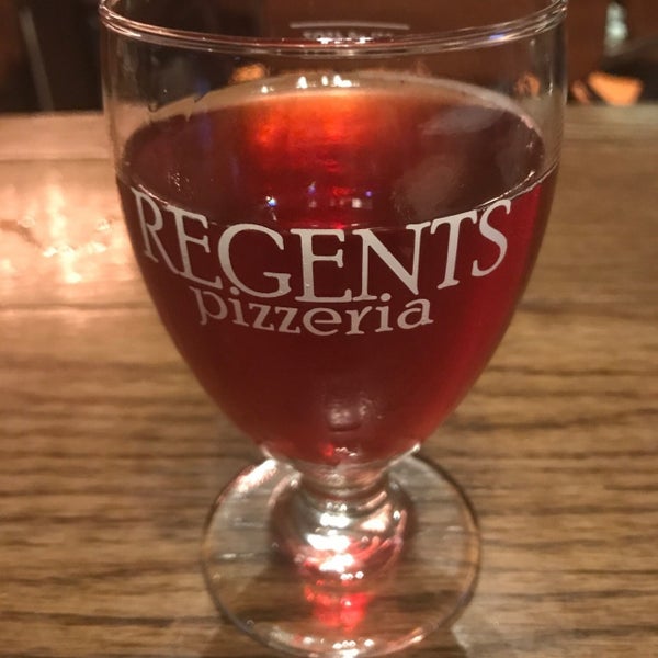 Photo taken at Regents Pizzeria by Oh F. on 5/5/2019