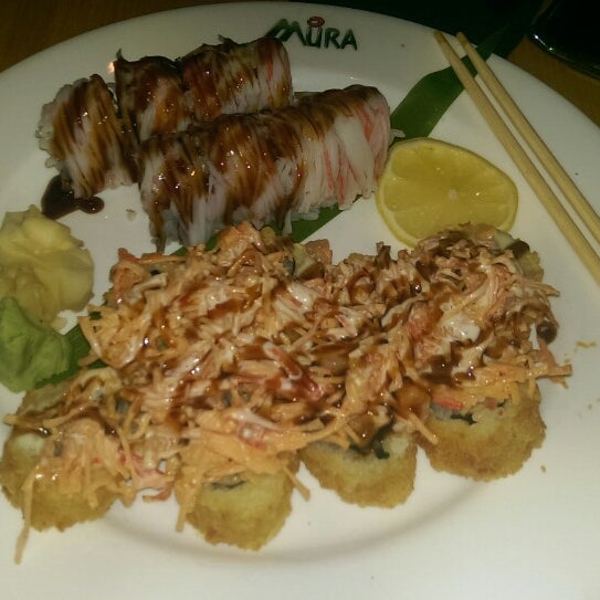 Photo taken at Mura Japanese Restaurant by Erin B. on 1/2/2015