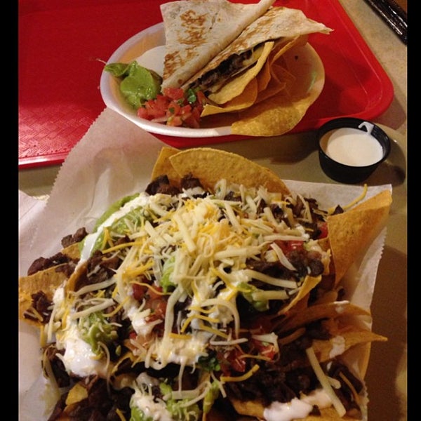 Photo taken at Taco Shop Mexican Grill by Angela D. on 3/6/2013