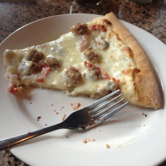 Photo taken at Rocco&#39;s Uptown Pizza &amp; Pasta by Kenny W. on 12/15/2012