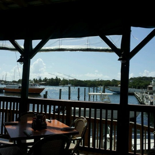Photo taken at Fish Tails Bar &amp; Grill by Bob V. on 9/22/2012