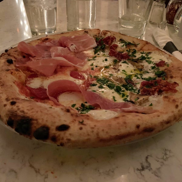 Amazing food and atmosphere! With the pizza they let you mix and match so I did half white truffle, half red spicy salami with prosciutto. Delicious!