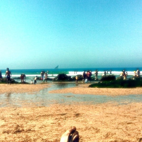 Photo taken at Praia dos Gémeos by Nuno H. on 6/13/2014