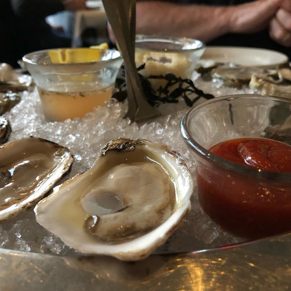 Photo taken at Henlopen City Oyster House by Devin H. on 3/16/2019