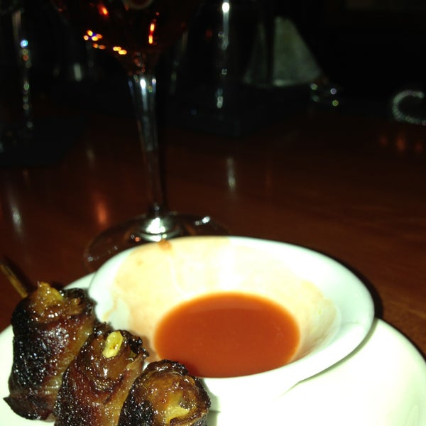 Bacon wrapped dates dipped in the hot sauce from the hard boiled eggs- pure magic.