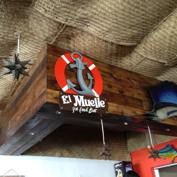 Photo taken at El Muelle Seafood Bar by Bernardo K. on 4/5/2013