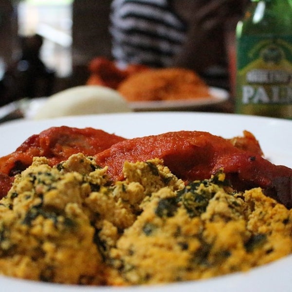 Photo taken at Buka Nigerian Restaurant by Justin F. on 6/8/2014
