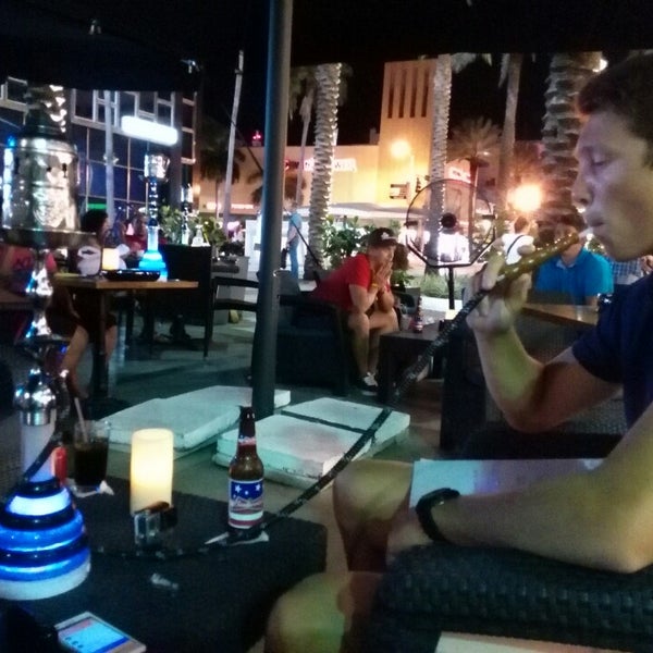Photo taken at Deco Drive Cigars and Hookah Lounge by Mathias B. on 7/20/2014